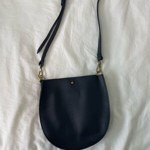 Sleek Black Crossbody Bag with Gold Hardware